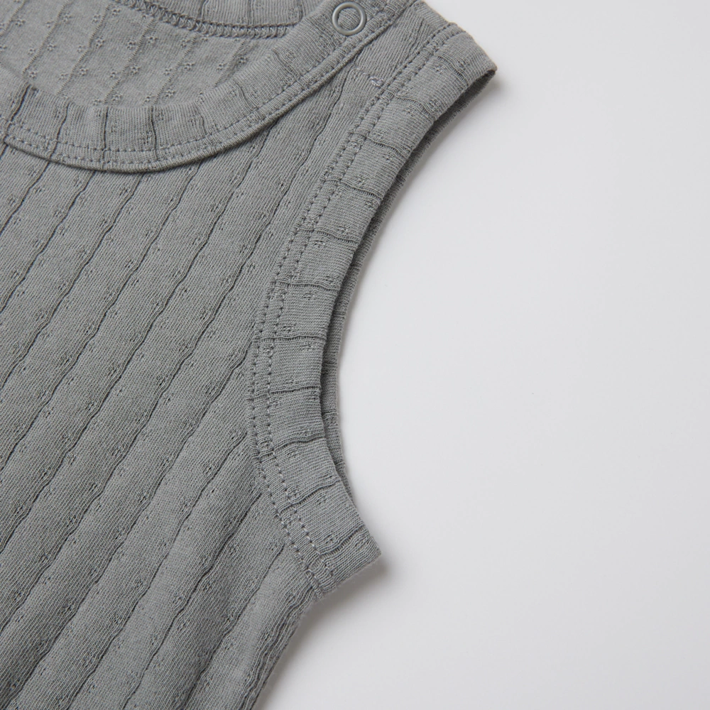 Pointelle sleeveless organic cotton baby bodysuit with plant-based dyes, eco-friendly design for infants 0-18 months