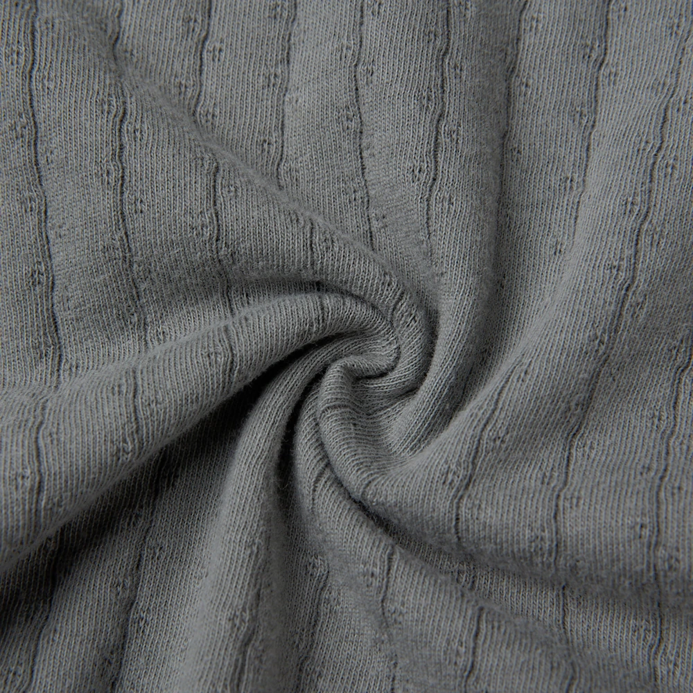 Pointelle sleeveless organic cotton baby bodysuit with plant-based dyes, eco-friendly design for infants 0-18 months