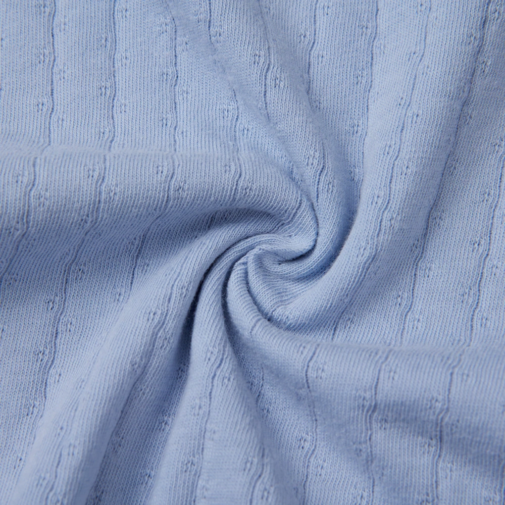 Pointelle sleeveless organic cotton baby bodysuit with plant-based dyes, eco-friendly design for infants 0-18 months