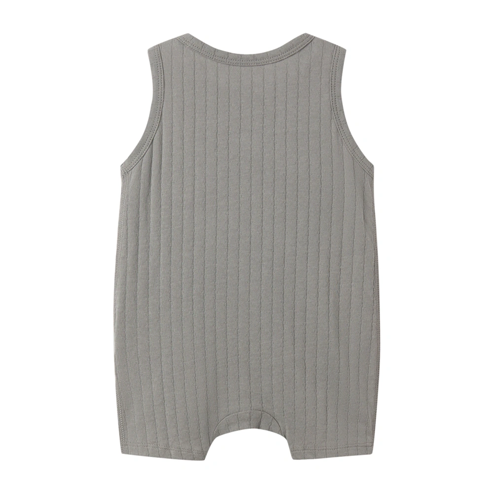 Baby wearing organic cotton plant-dyed unisex romper

