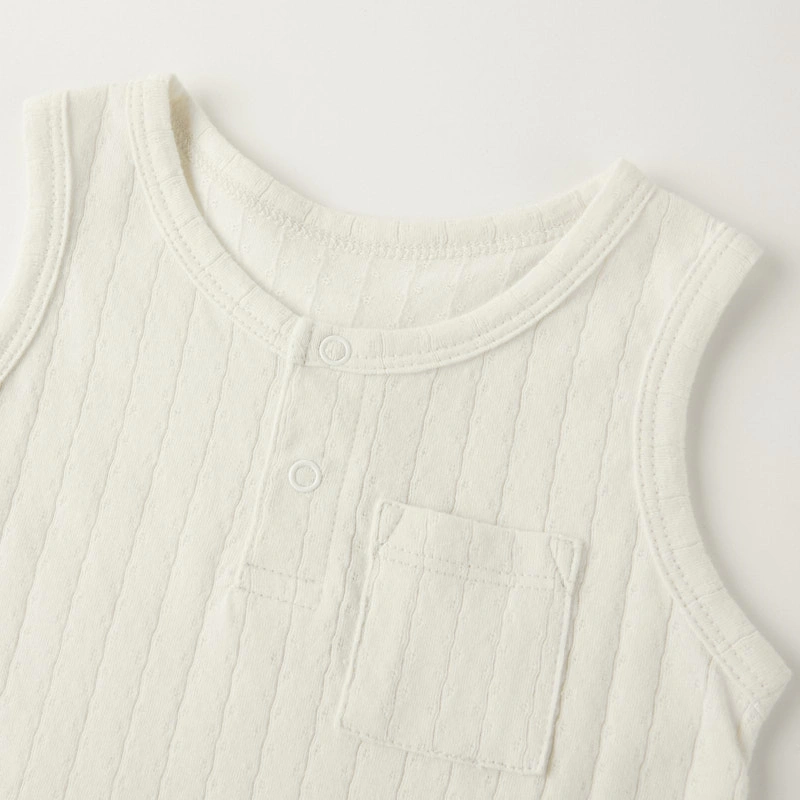 Baby wearing organic cotton plant-dyed unisex romper

