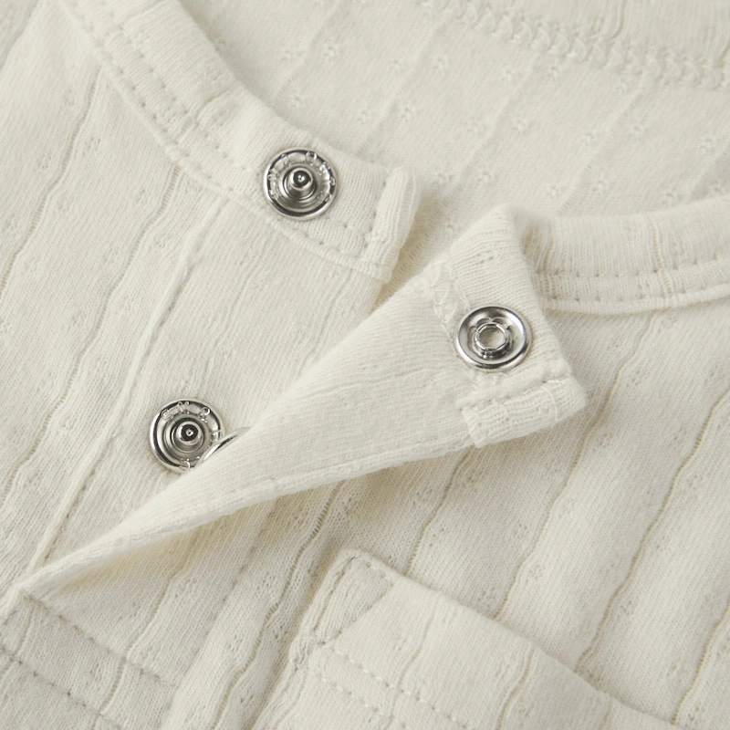 Nickel-free gusset snaps on plant-dyed organic cotton romper
