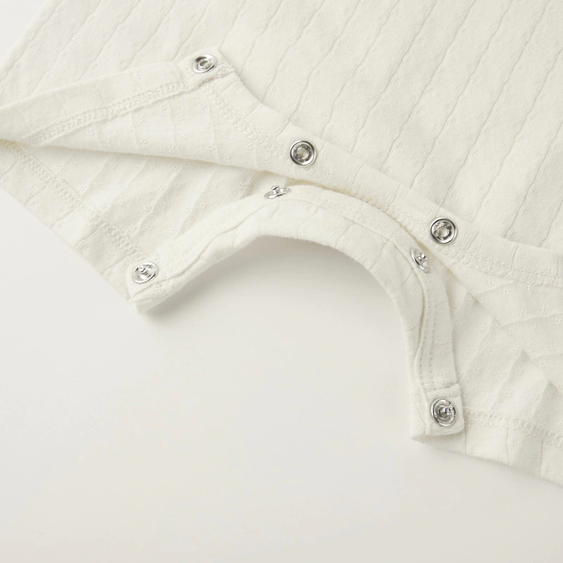 Baby wearing organic cotton plant-dyed unisex romper

