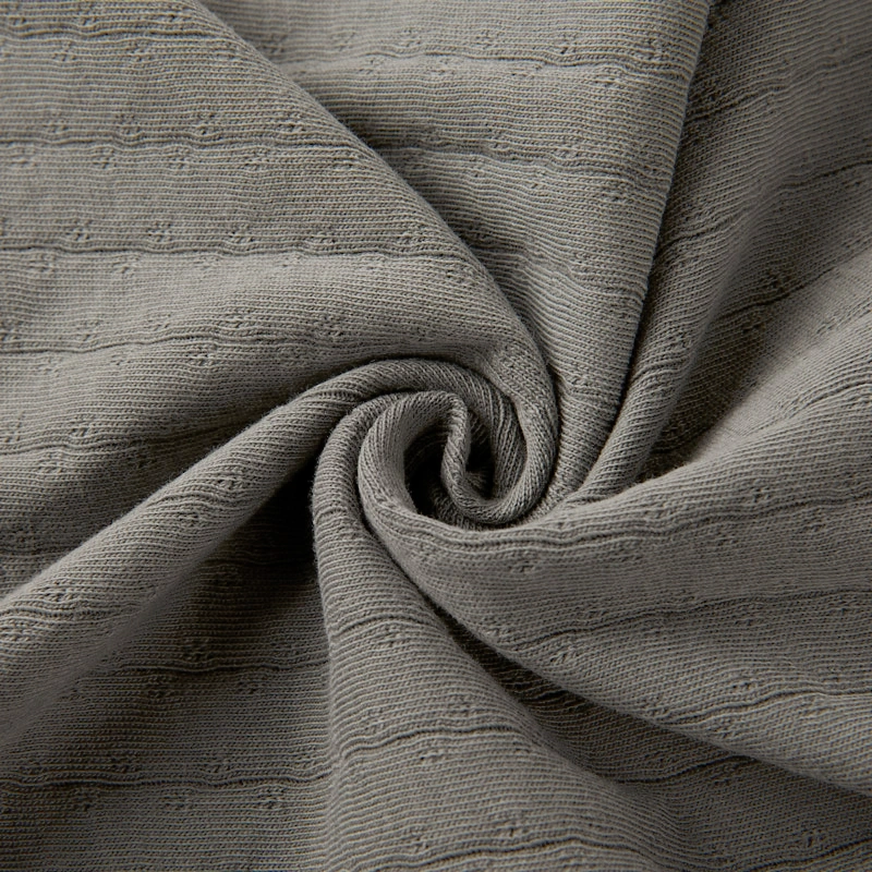 Baby wearing organic cotton plant-dyed unisex romper

