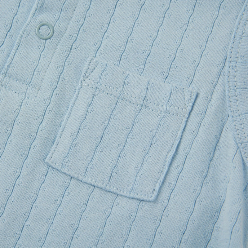 Baby wearing organic cotton plant-dyed unisex romper

