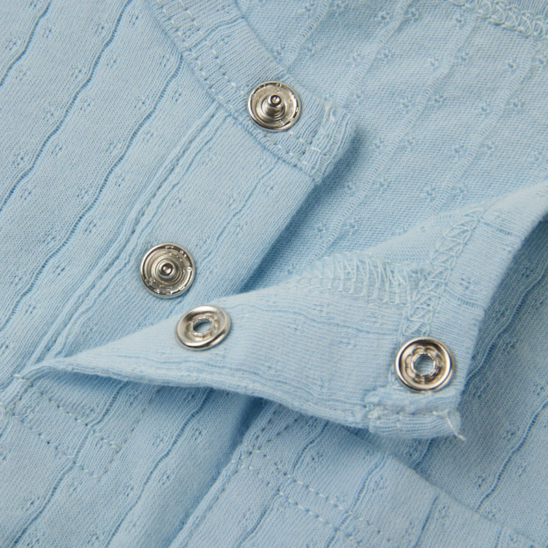 Baby wearing organic cotton plant-dyed unisex romper

