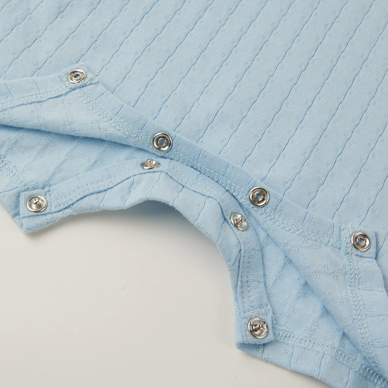 Baby wearing organic cotton plant-dyed unisex romper

