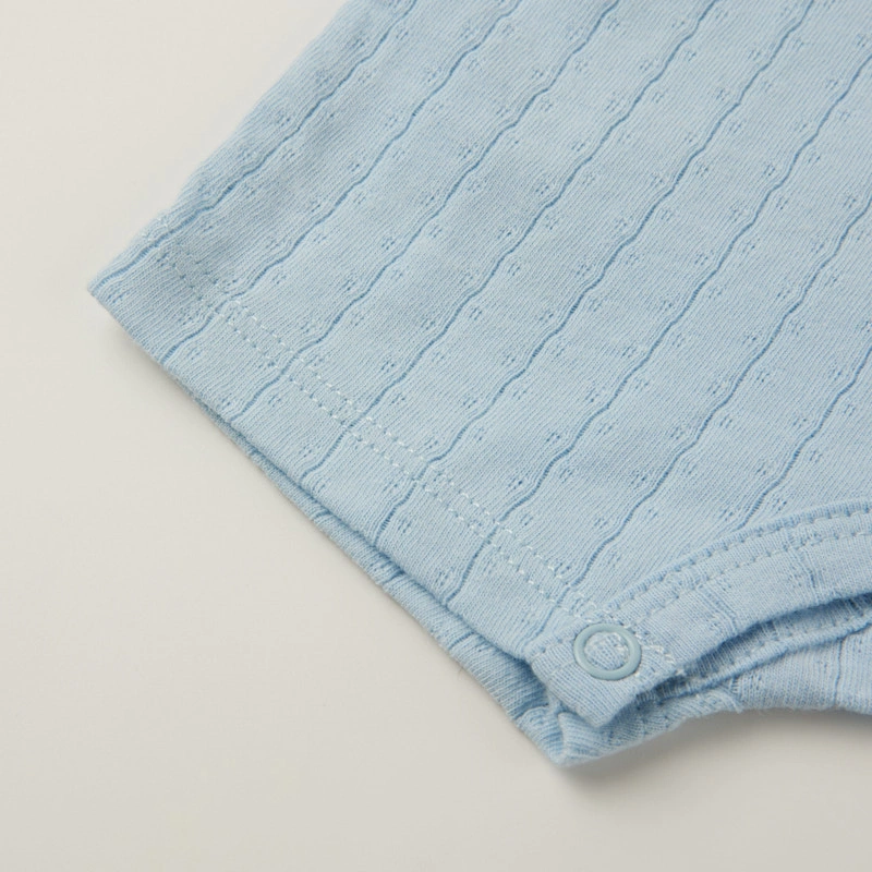 Baby wearing organic cotton plant-dyed unisex romper

