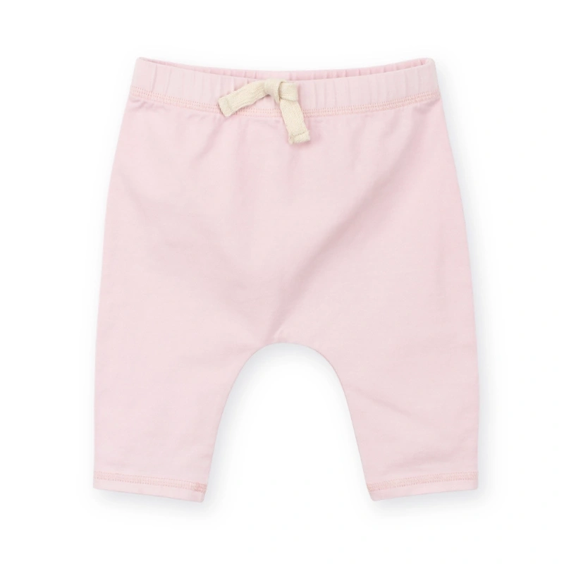 Back view of SENSENG unisex baby track pants in plant-dyed botanical natural lavender colorway, showcasing relaxed jogger silhouette.