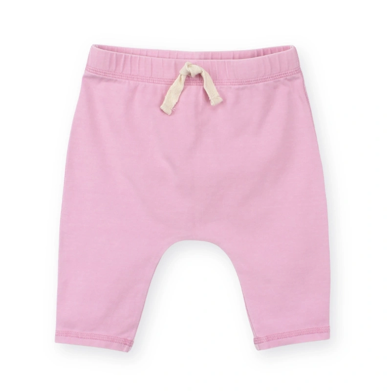 Back view of SENSENG unisex baby track pants in plant-dyed botanical natural baby pink colorway, showcasing relaxed jogger silhouette.
