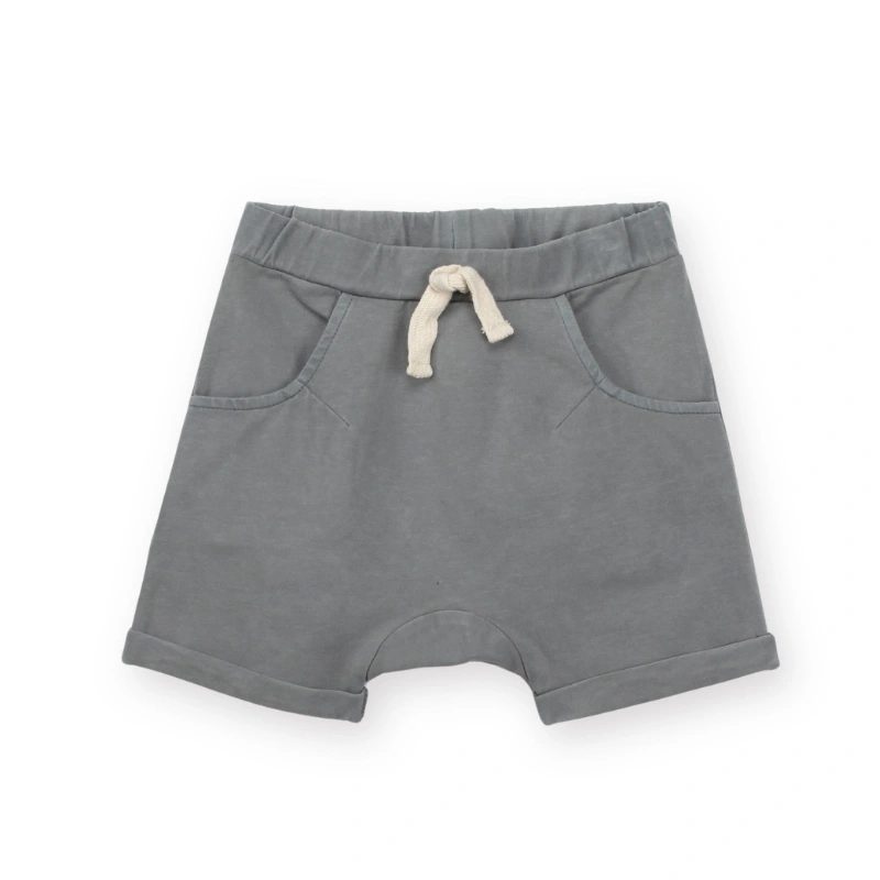 Picture of a baby boy wearing Senseng organic cotton baby knit jogger shorts with plant-dyed color