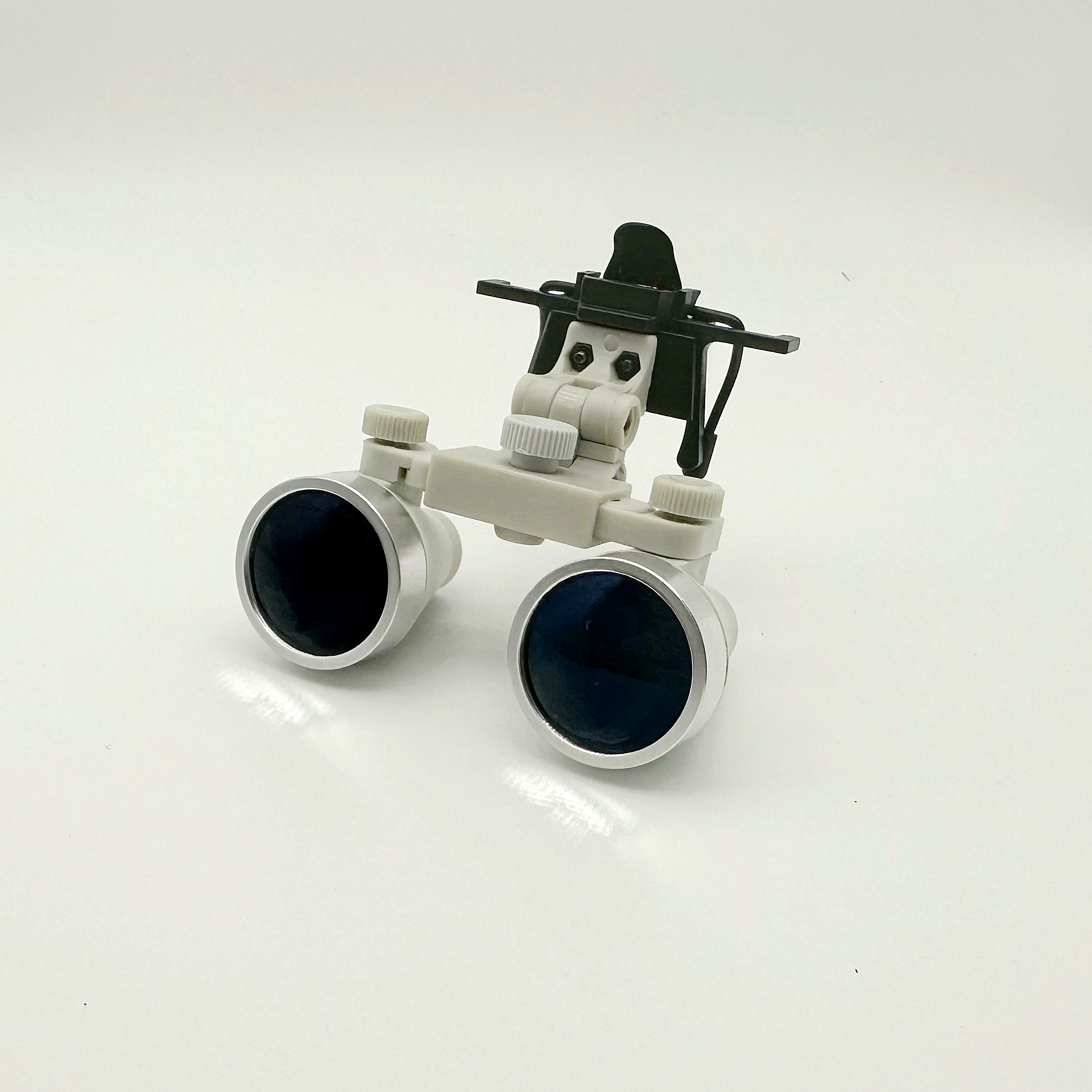 CareOptik clip-on dental loupes front view with flip-up handle