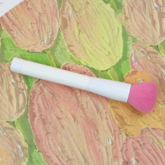 Blush brush with pink nylon hair and pure white handle