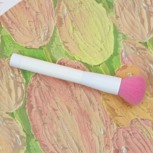 Blush brush with pink nylon hair and pure white handle