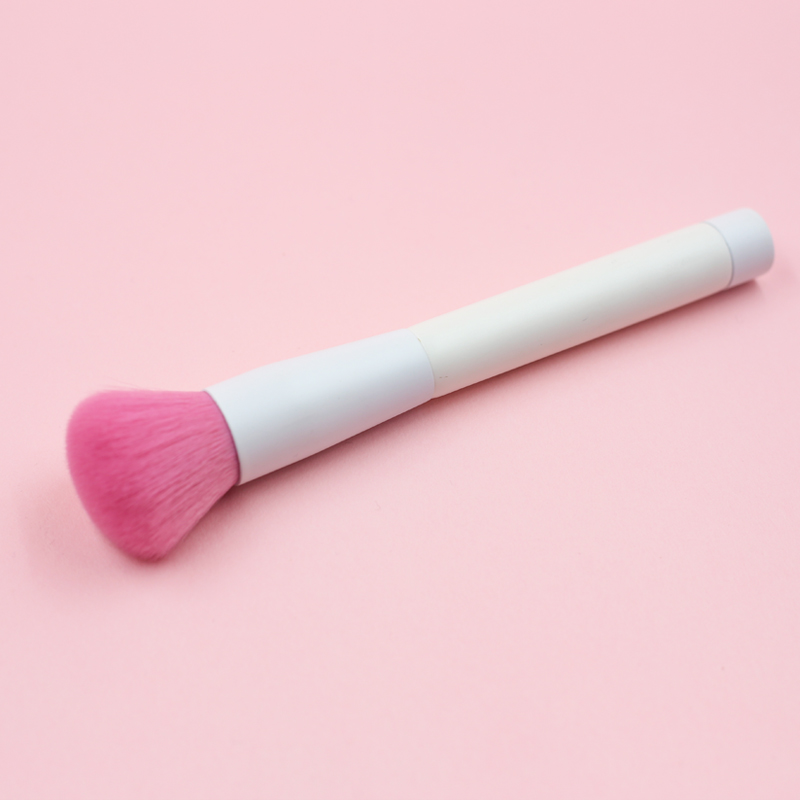 Blush brush with pink nylon hair and pure white handle