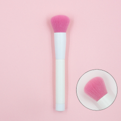 Blush brush with pink nylon hair and pure white handle