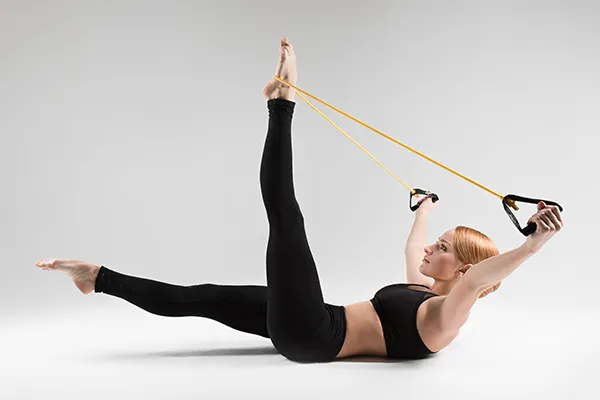 Two color yarn cross strap pilates socks detail showing grip sole and strap design