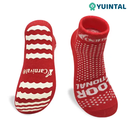 Red custom trampoline park socks with knitted logo and full-sole PVC grip
