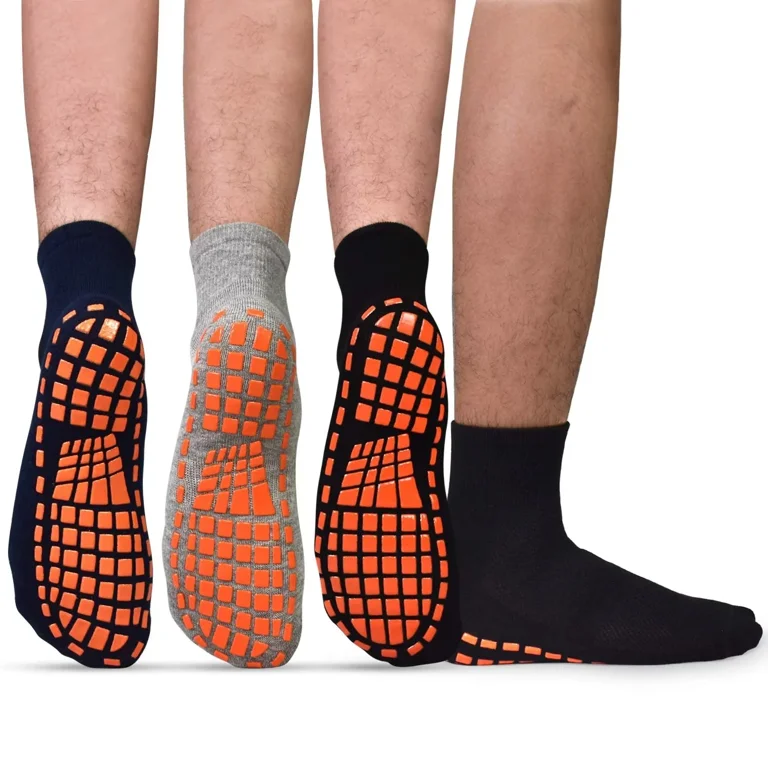 Multiple pairs of grip socks showing different silicone anti-slip sole patterns on a white background