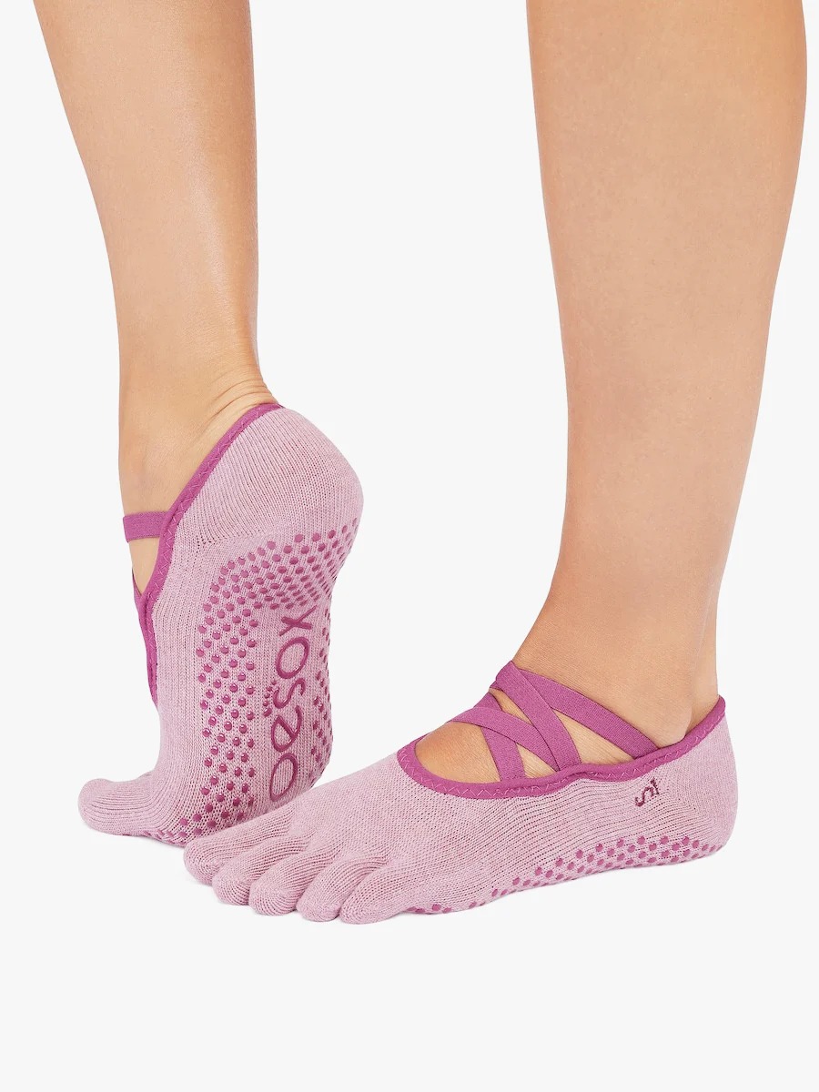 Five-toe grip socks with silicone traction dots, showing sole grip pattern designed for stability on smooth indoor floors