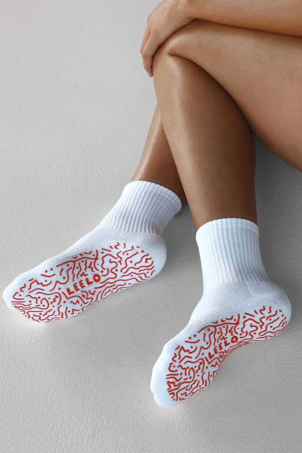 White grip socks with full-sole silicone traction &mdash; OEM custom grip socks manufacturer for yoga studios and trampoline parks