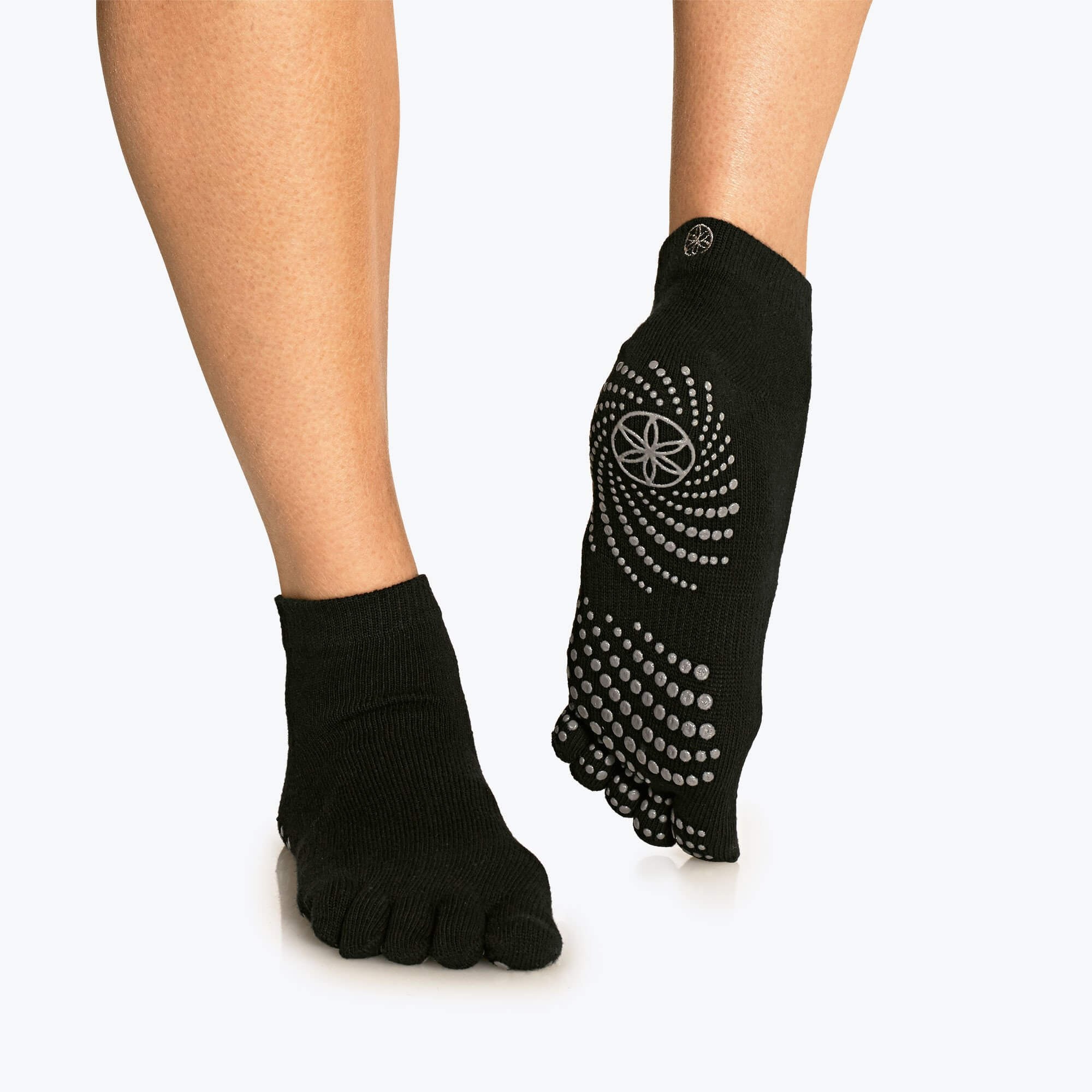 five toe grip socks with spiral silicone grip layout designed for balance and foot articulation