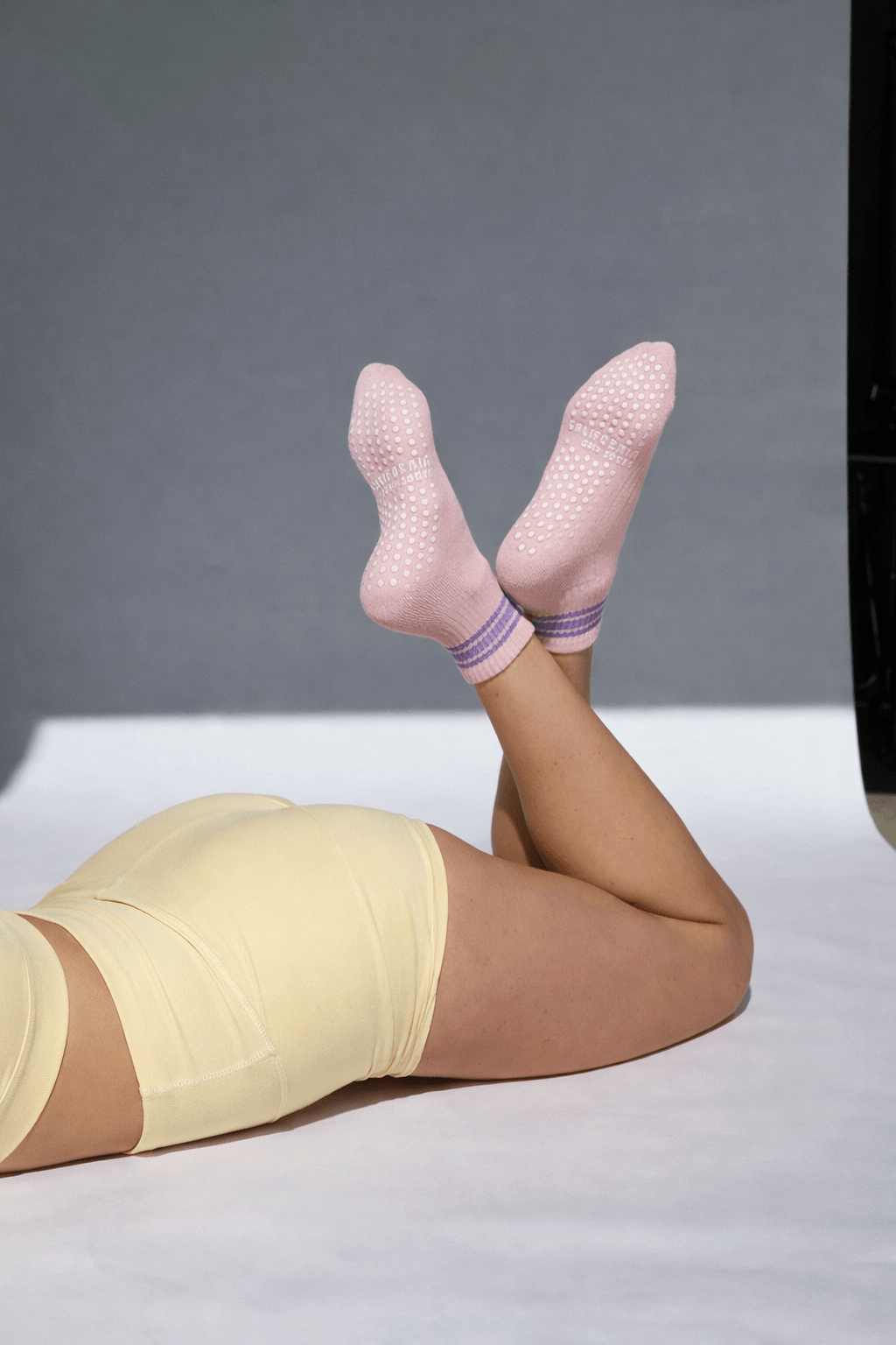 branded pilates socks in soft pink with grip pattern, private label pilates grip socks for studio and retail collections