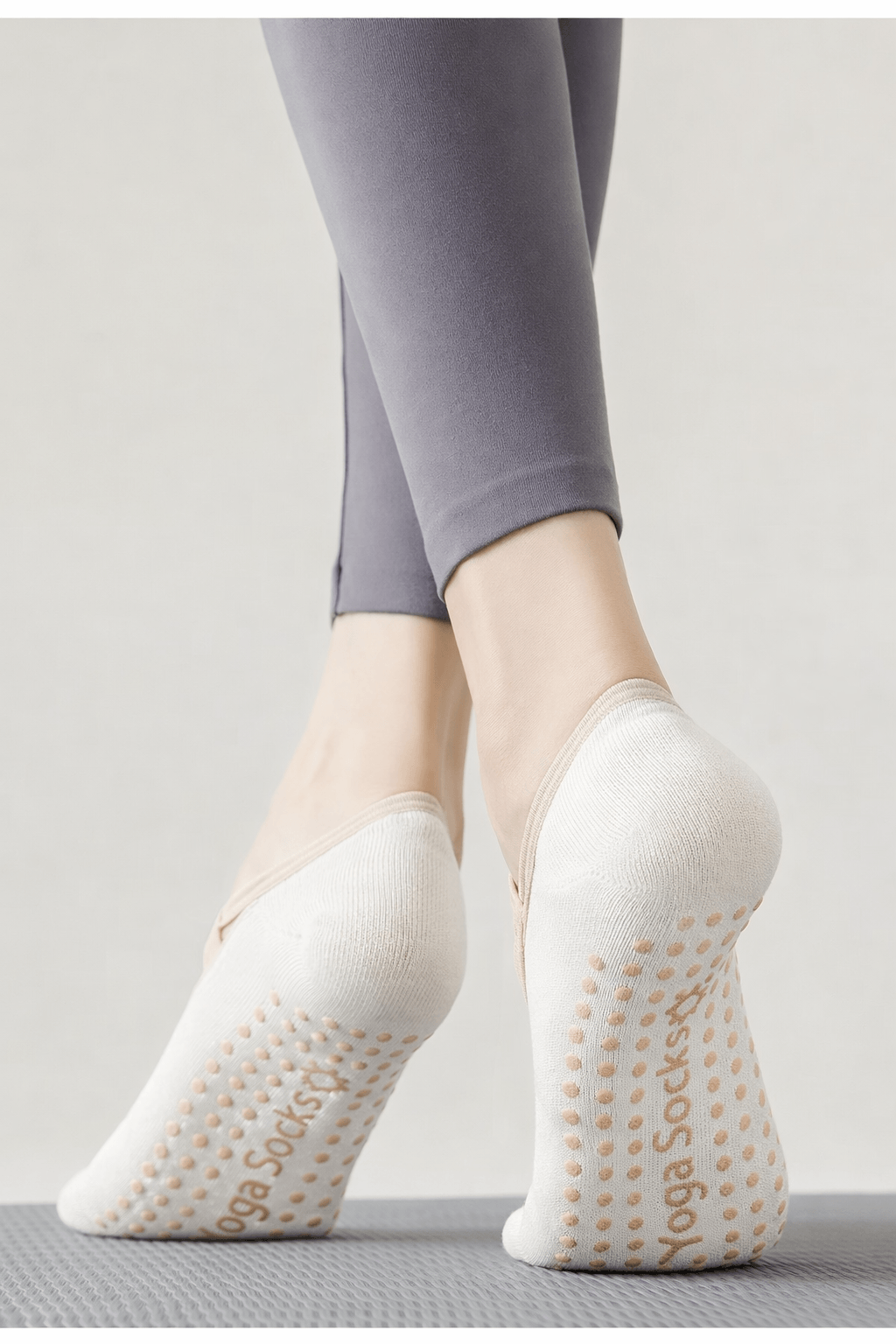 Bottom view of private label yoga socks with grip dots, non slip branded yoga grip socks for pilates and yoga