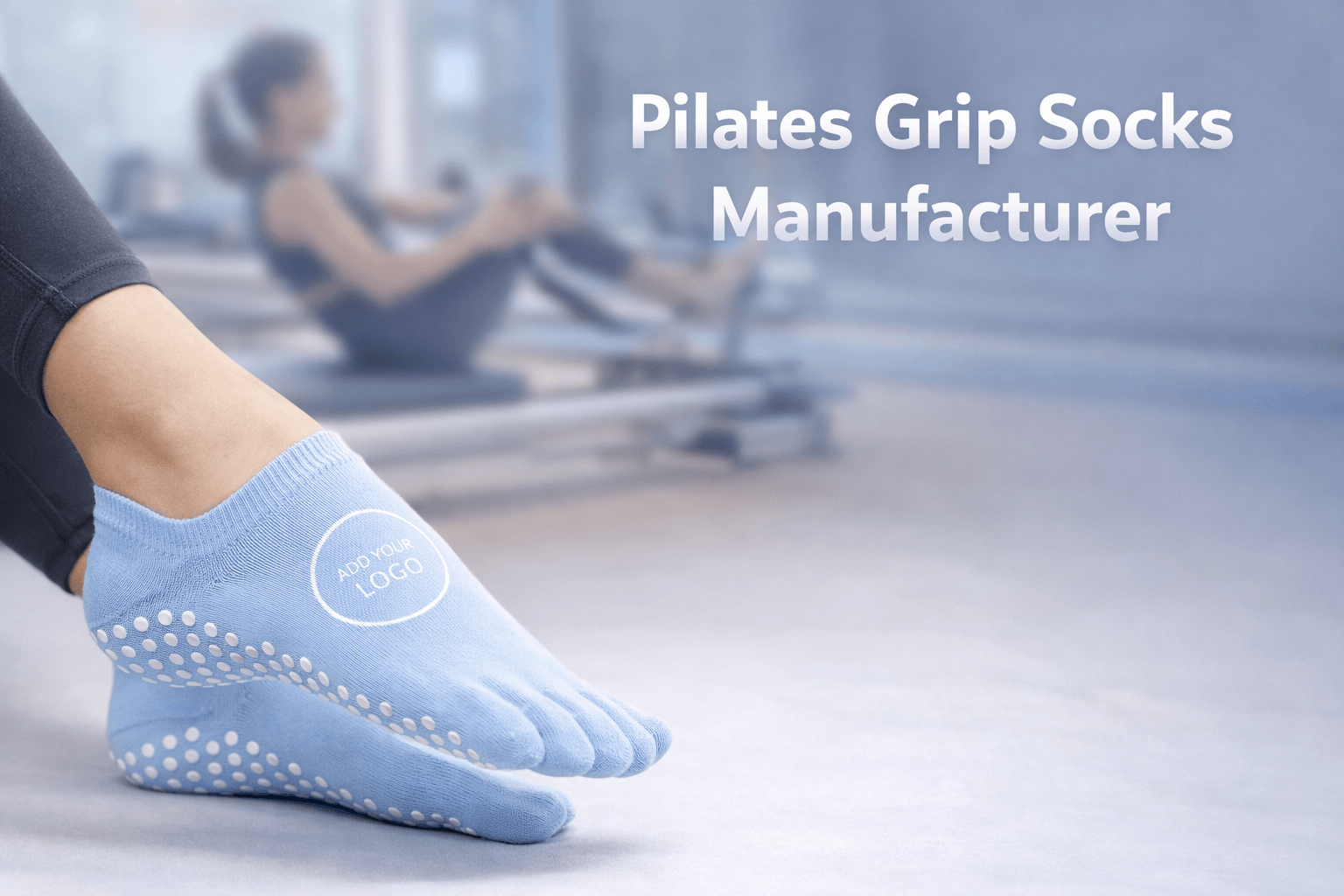 Pilates grip socks with custom logo area, anti-slip silicone sole, worn in fitness studio with blurred background, commercial manufacturer concept image