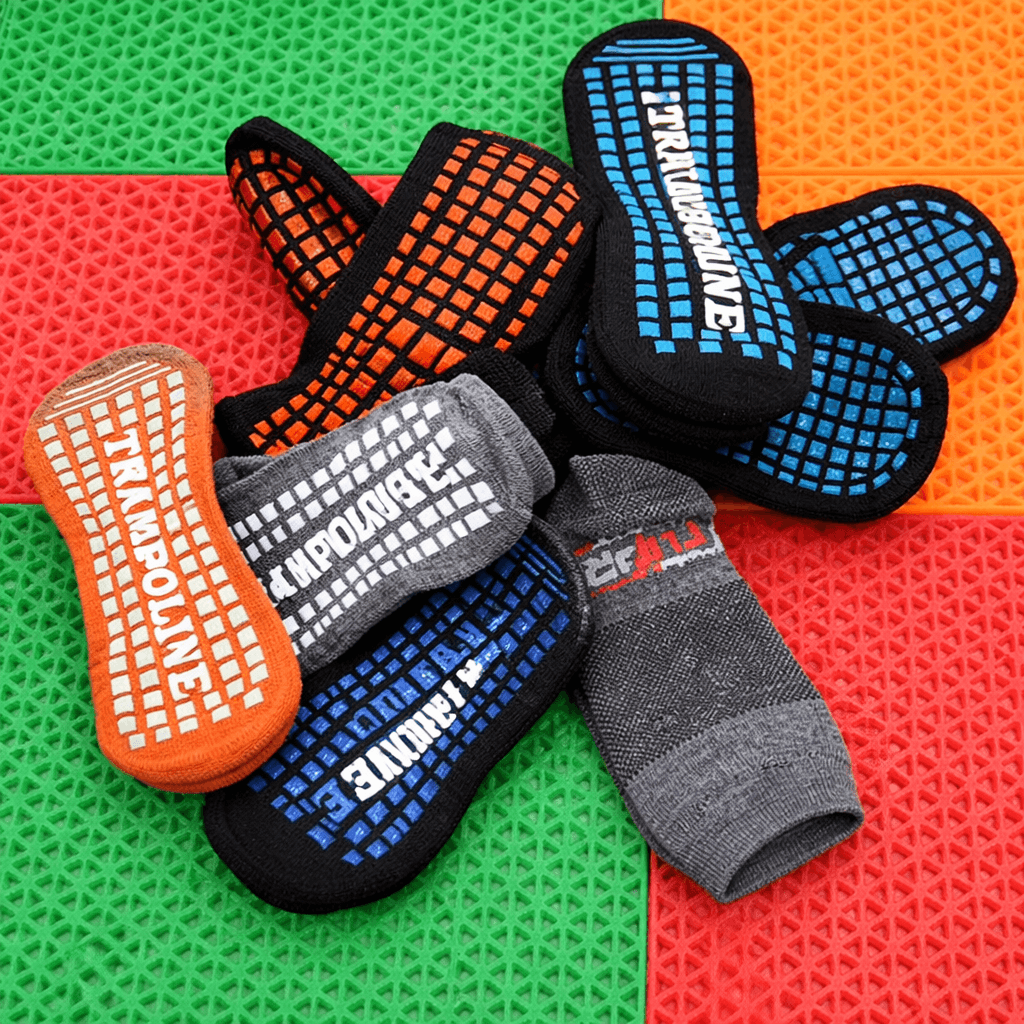 custom trampoline socks with anti slip grip patterns, colorful trampoline park socks custom design for indoor playgrounds and trampoline grip socks OEM production