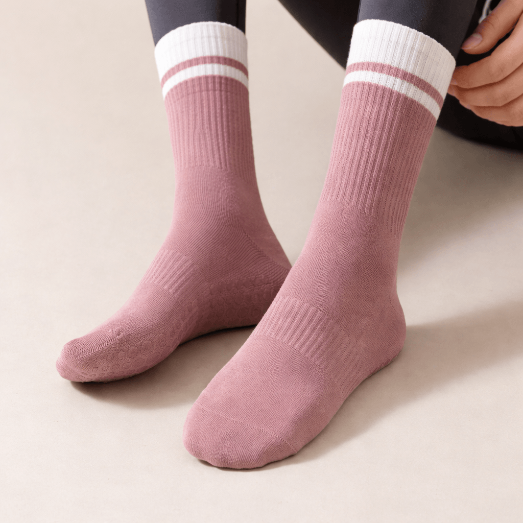 branded yoga grip socks in soft pink color with non slip grip pattern, custom yoga socks for pilates and yoga studios with comfortable stretch fit