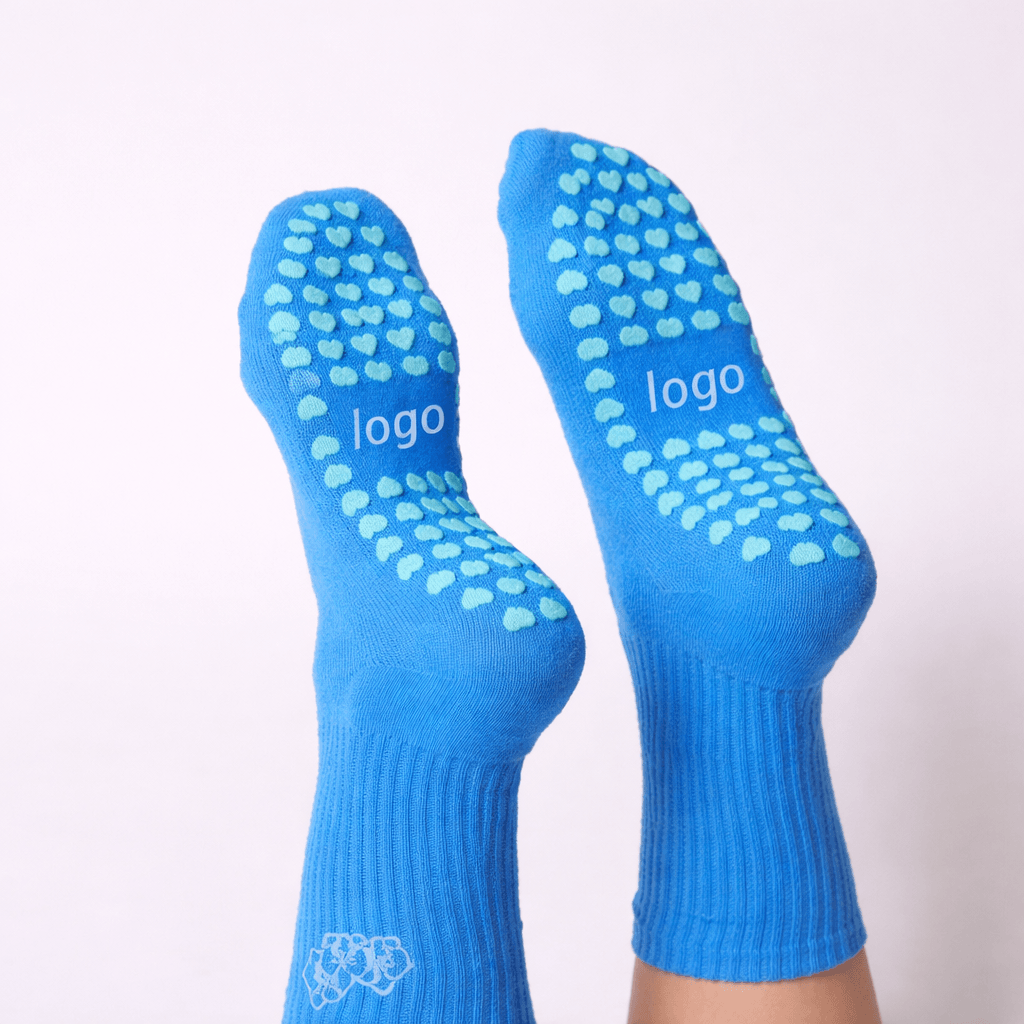custom logo grip socks with silicone heart grip pattern, branded grip socks in blue color for yoga, pilates and indoor training use