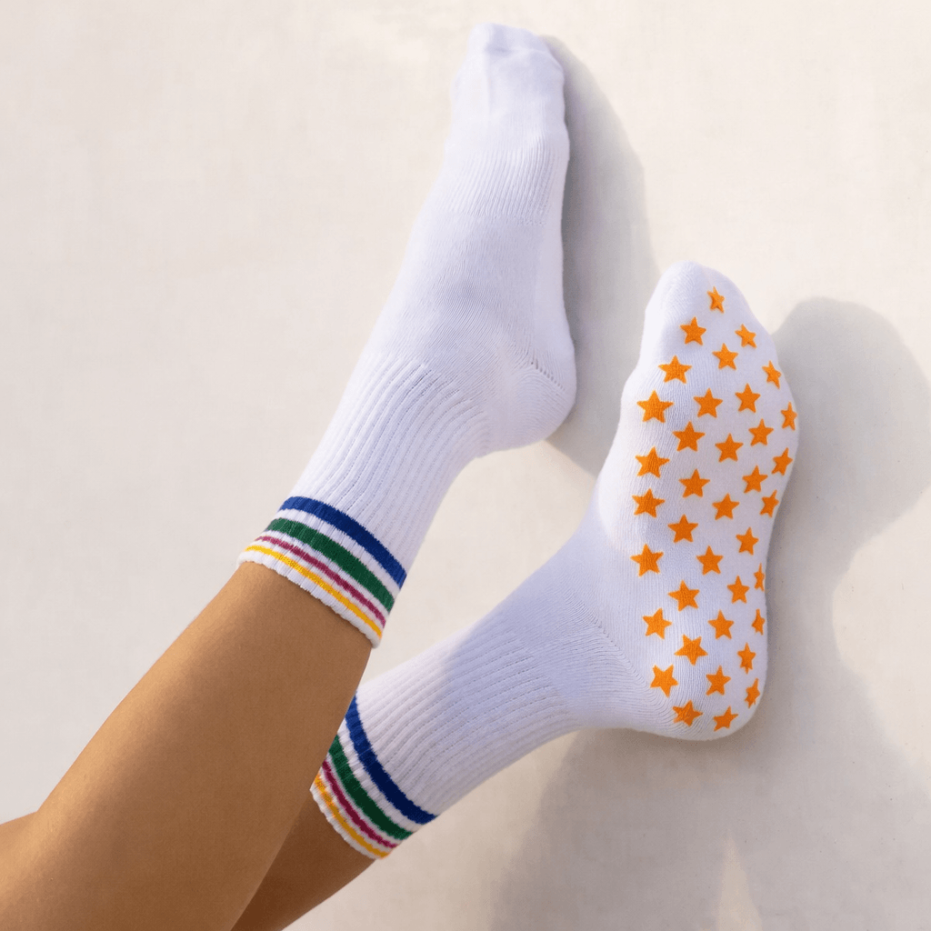 white grip socks with orange star pattern anti slip sole for yoga pilates indoor training