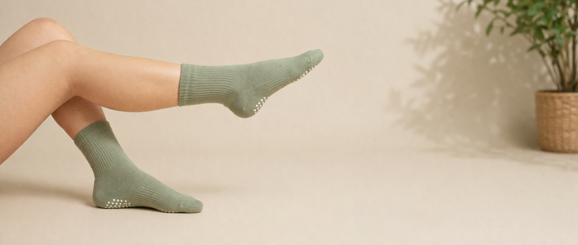 minimalist studio scene with pilates socks bulk supply, green grip socks for pilates studios with non slip sole design