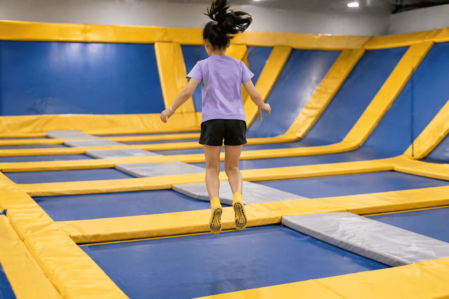 why trampoline parks require grip socks kids jumping safely with anti slip socks in trampoline park environment