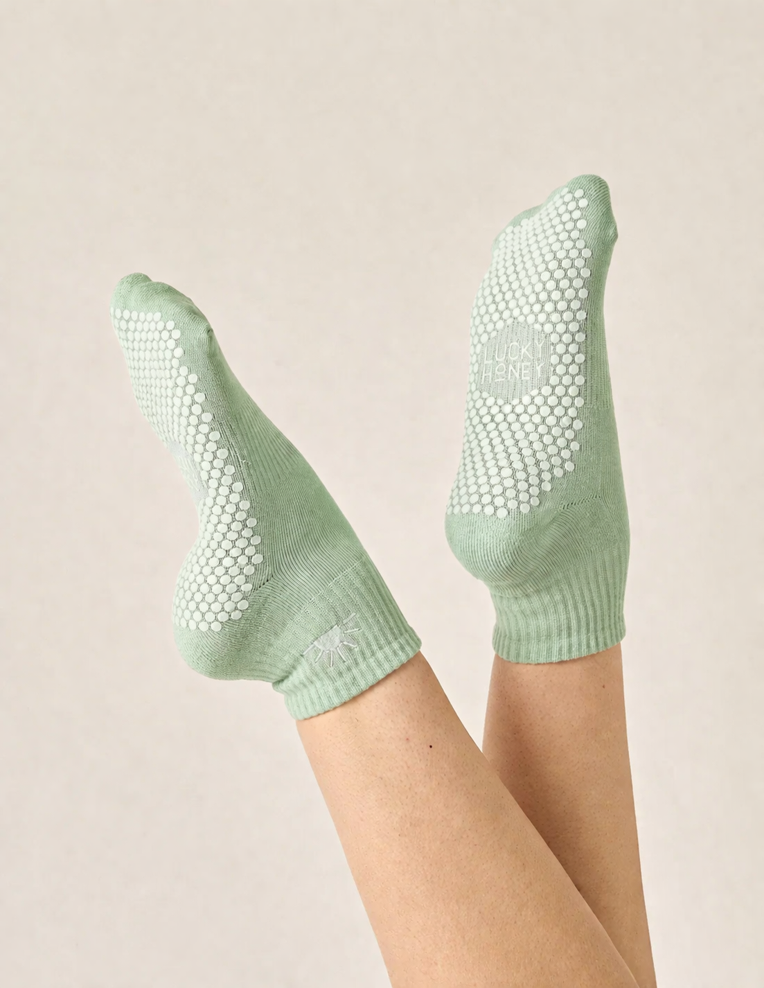 pilates socks vs barefoot close up of grip dots on socks highlighting stability safety and hygiene advantages over barefoot