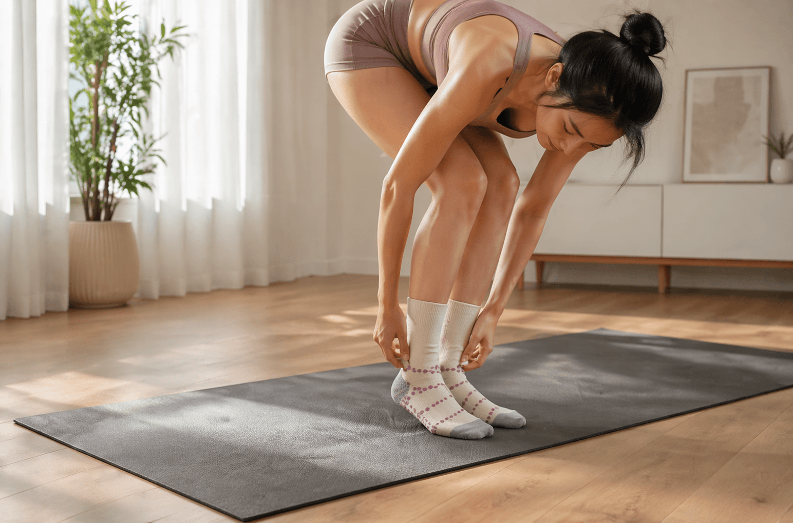are yoga grip socks necessary for home workouts woman wearing grip socks for stability and comfort