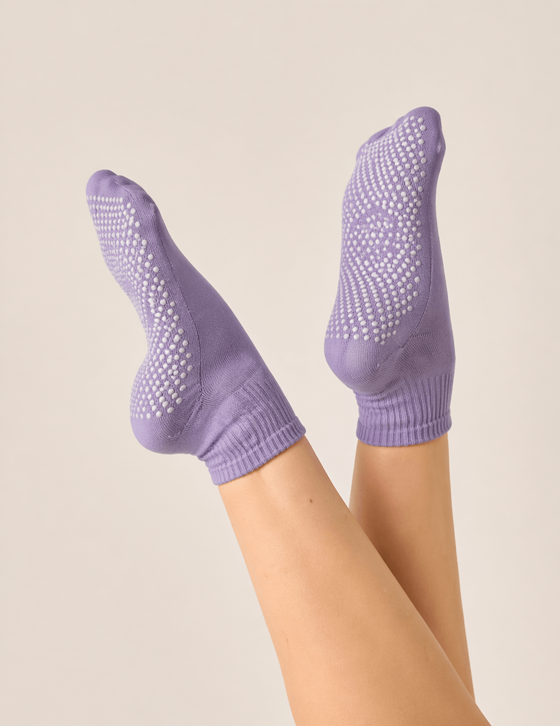 yoga barefoot vs socks product style image showing purple yoga grip socks with full sole grip coverage