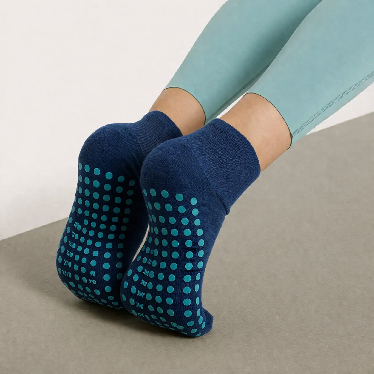 Navy blue crew grip socks for gyms with full-sole grip dots, high-quality fitness socks bulk supply by trusted gym grip socks supplier, suitable for all fitness activities.