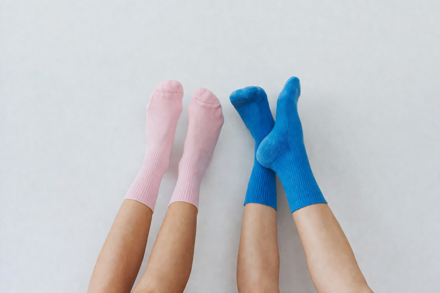 pilates socks vs barefoot comparison floor surface showing why grip socks improve traction and reduce slipping during pilates exercises