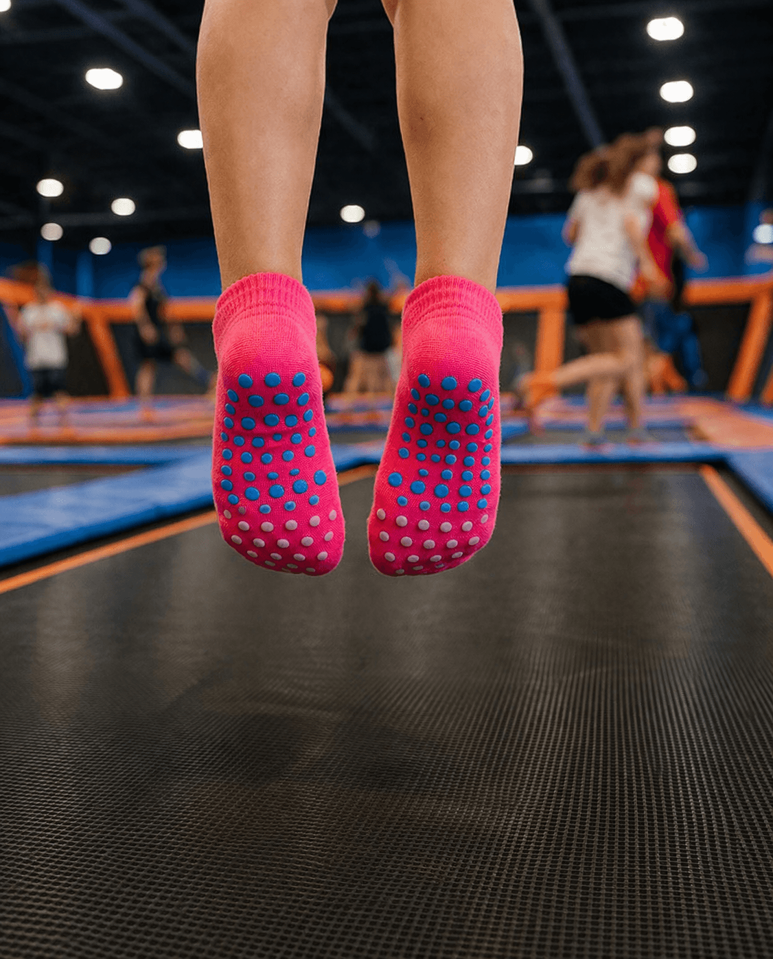 bright grip socks for trampoline parks jumping scene, non slip trampoline park socks supplier, jump socks bulk for active play