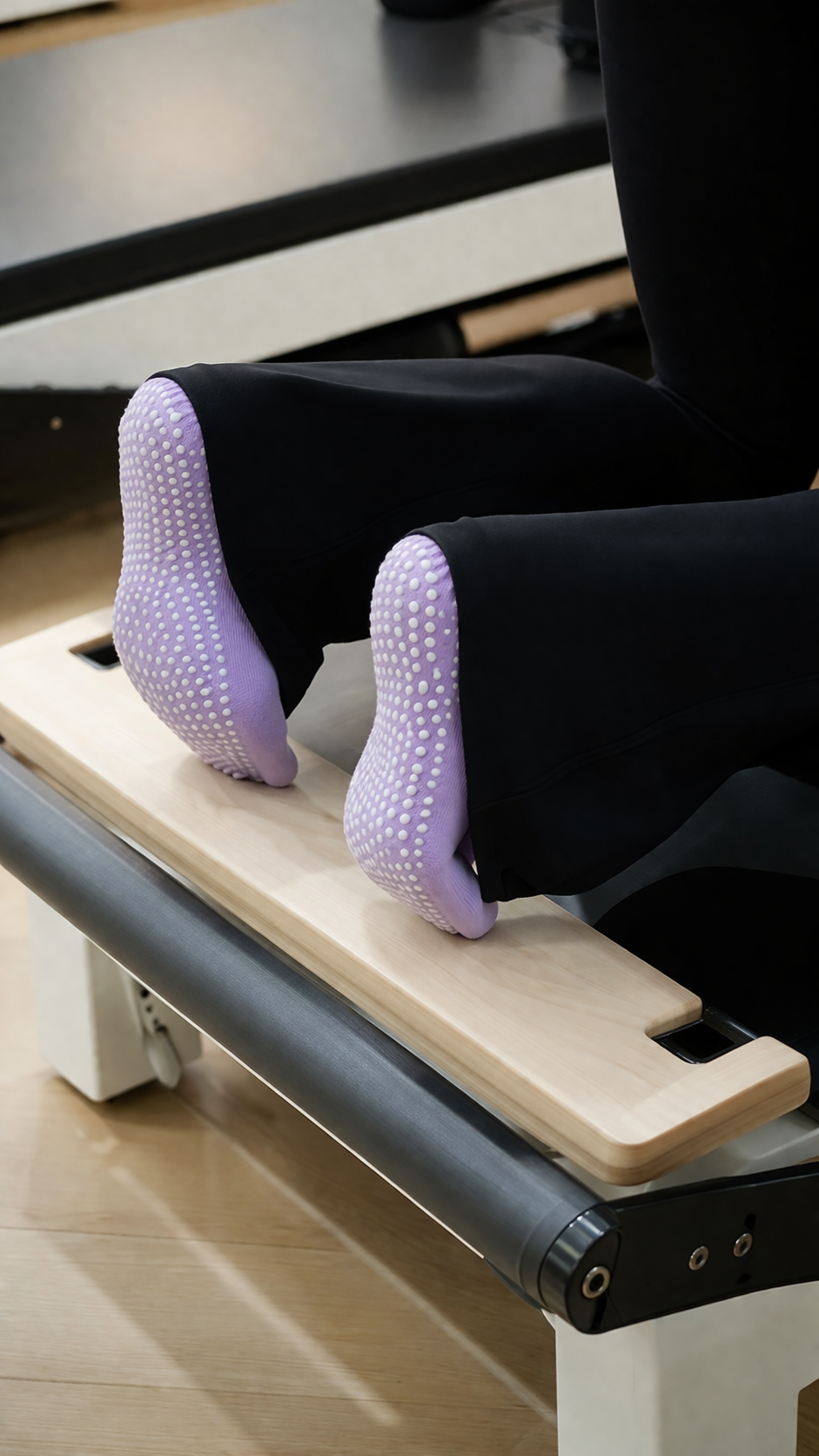 pilates grip socks vs barefoot conceptual comparison showing benefits of grip socks for safety control and professional studio use