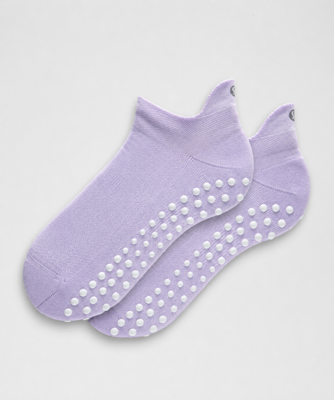 Close view of silicone grip dots on children's indoor playground socks