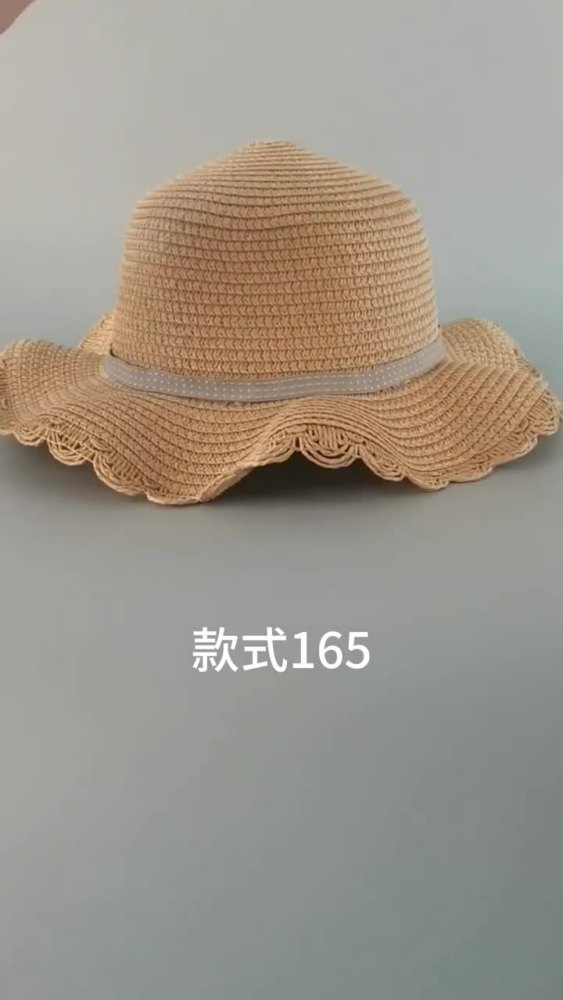 New style round-top straw hat with polka dot ribbon and pearl trim, perfect for beach outings.