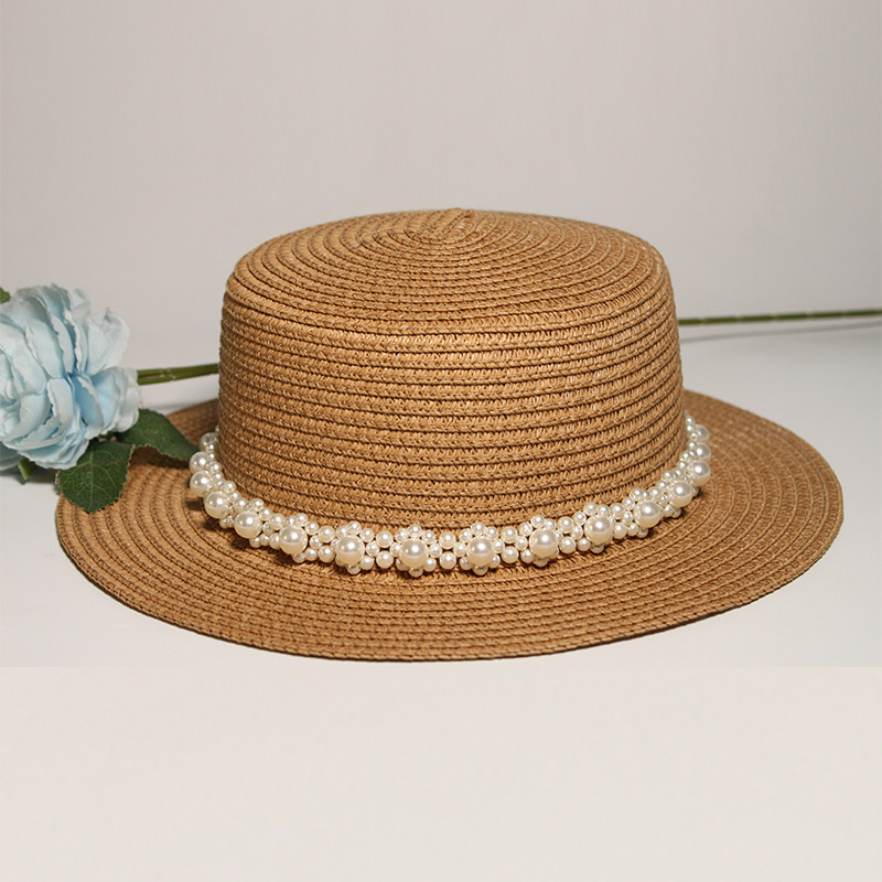 Hat band New style round-top straw hat with polka dot ribbon and pearl trim, perfect for beach outings.