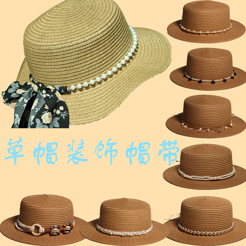 New style round-top straw hat with polka dot ribbon and pearl trim, perfect for beach outings.