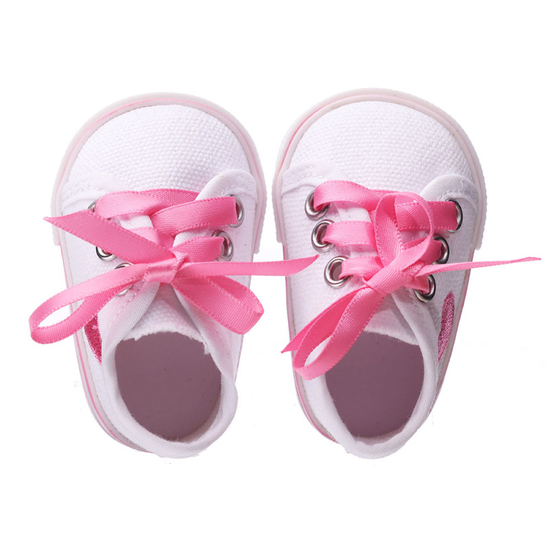White shoes with red hearts