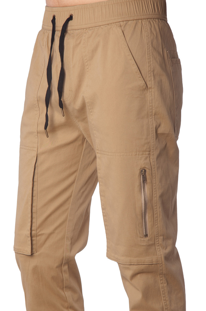 Close-up of metal zipper pocket on black slim-fit joggers for secure phone storage