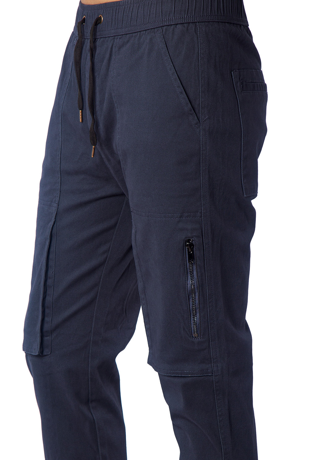 Close-up of metal zipper pocket on black slim-fit joggers for secure phone storage