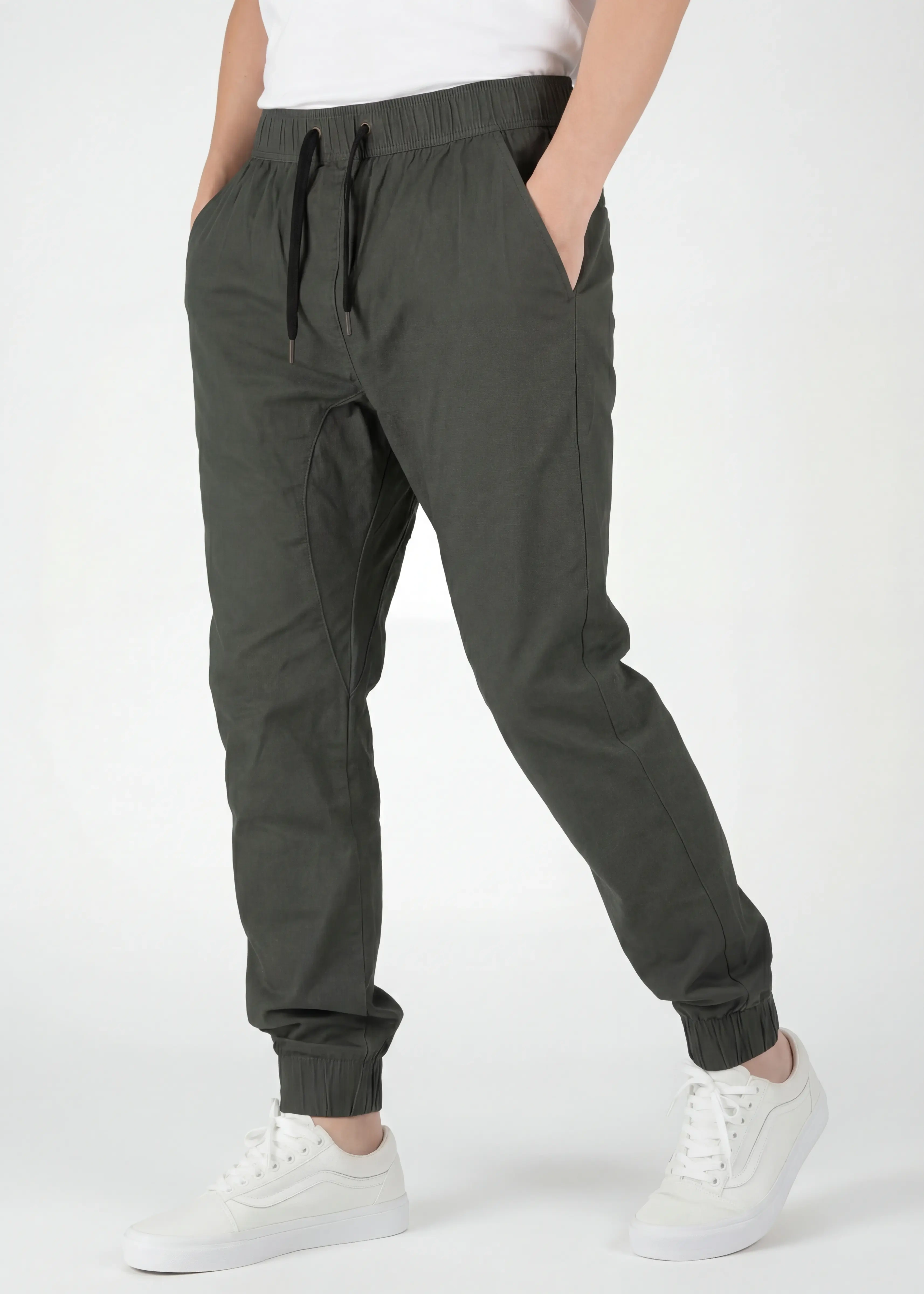 Close-up front angle of ItalyMorn men's army green jogger pants, emphasizing the smooth fabric drape, tailored side seams, and comfortable everyday fit